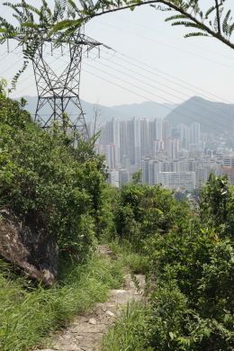 A trail under a power line, with Aberdeen in the background